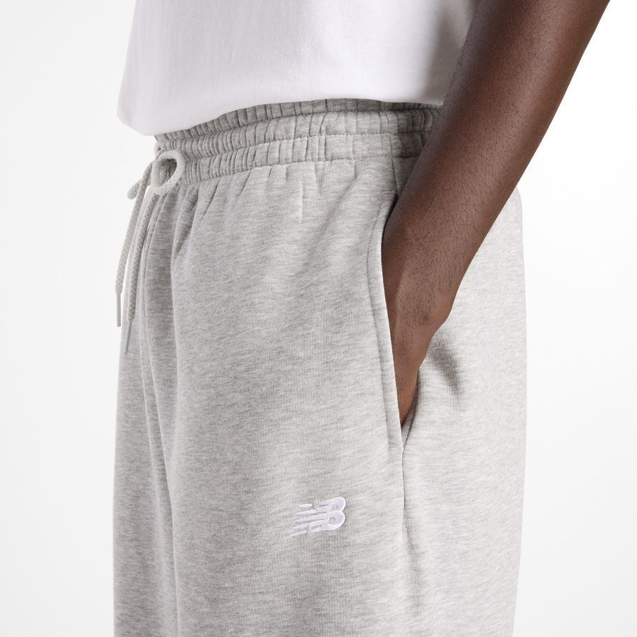 New Balance miesten collegehousut Sport Essentials Fleece Pant, vaaleanharmaa