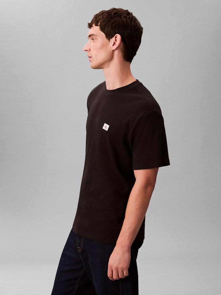 Calvin Klein Jeans miesten t-paita SS Waffle Badge Crewnk Tee, musta