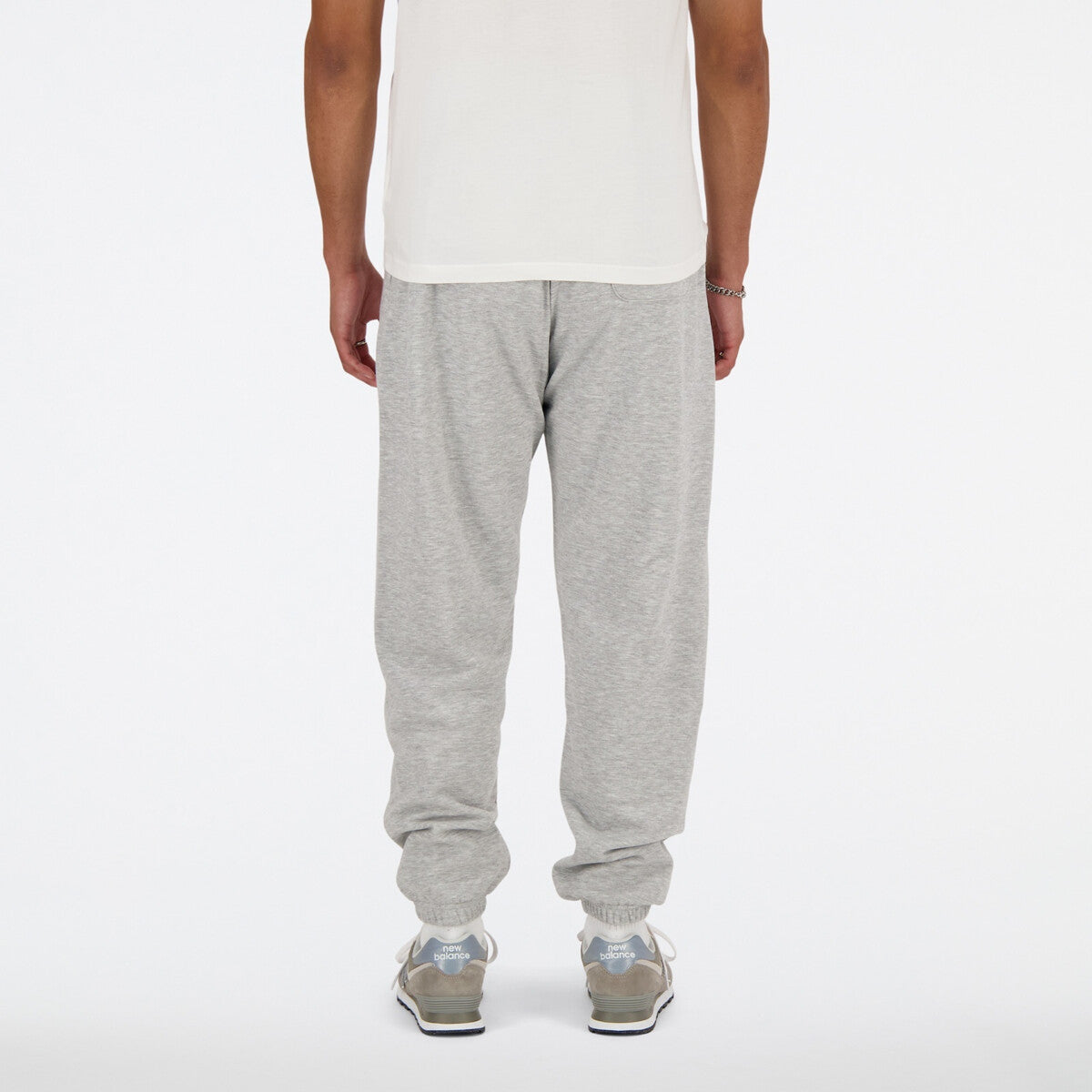 New Balance miesten collegehousut Sport Essentials French Terry Jogger, vaaleanharmaa