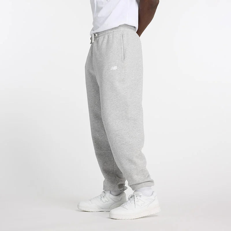 New Balance miesten collegehousut Sport Essentials Fleece Jogger Pants, vaaleanharmaa