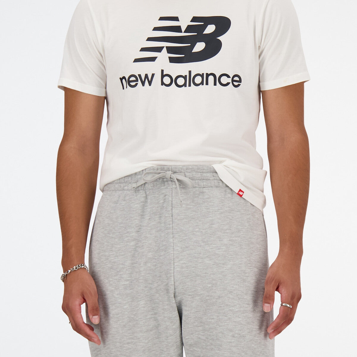 New Balance miesten collegehousut Sport Essentials French Terry Jogger, vaaleanharmaa