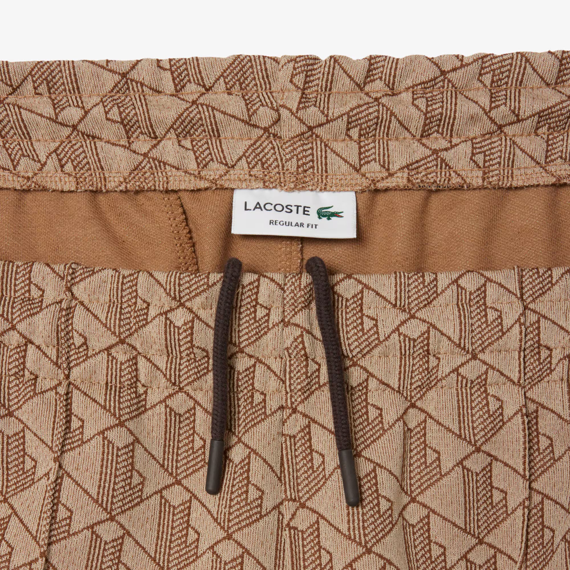 Lacoste miesten verryttelyhousut Parit Monogram Track Pant, beige