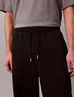 Calvin Klein Jeans miesten joggerit, LS PREMIUM TERRY CK EMBLEM JOGGER Musta